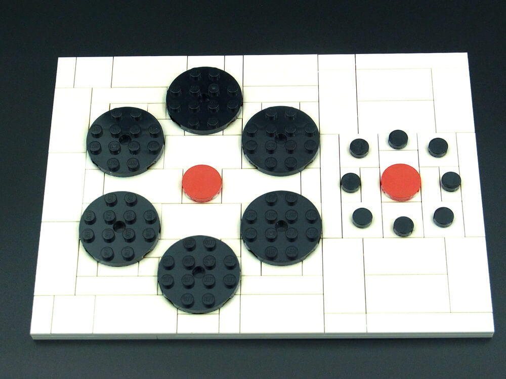 エビングハウス錯視のレゴ作品を色味を変えて写したもの。ブロックの目地が見えると同じサイズだと分かります。